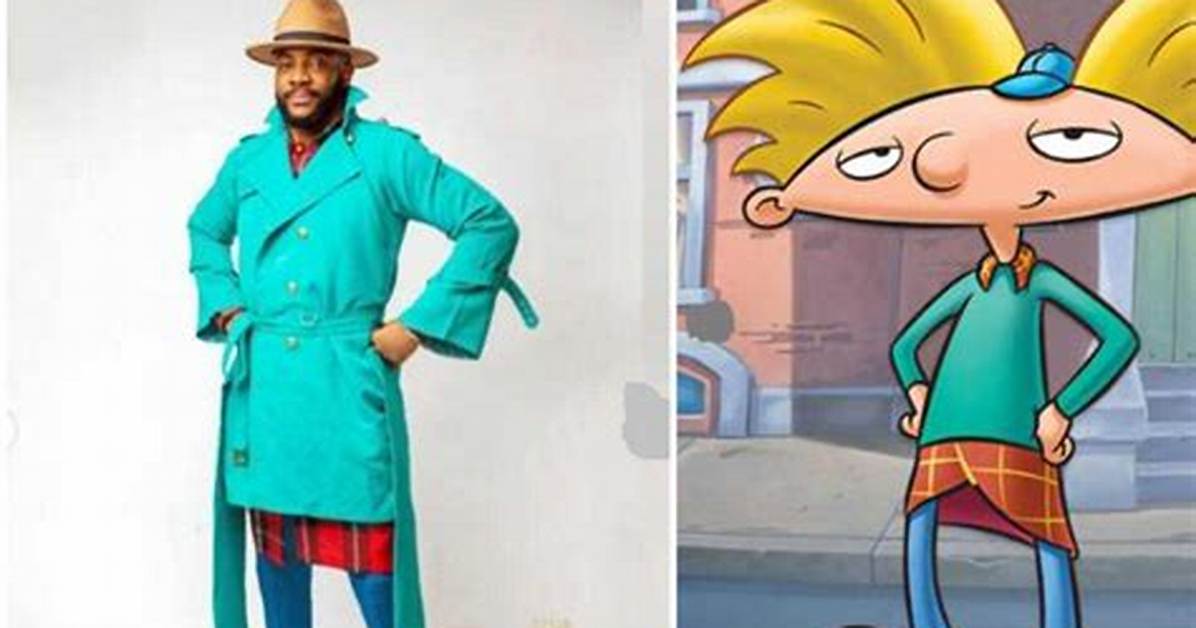 Ebuka Sports Blue Trench Coat Brown Fedora Hat as He Dresses up as 90S