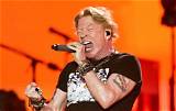 Guns N’ Roses’ Axl Rose Says He’ll Stop ‘Tossing the Mic’ into Crowd After Reportedly Injuring Fan
