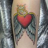 Heart with Wings and Halo Tattoo: a Symbol of Love and Freedom
