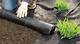 How to Lay Landscaping Fabric Behind a Retaining Wall