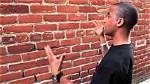 Man Talks to Brick Wall: Understanding the Symbolism, Psychology, and Impact