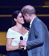 Meghan Markle Kisses Prince Harry During Glamorous Polo Tournament Appearance