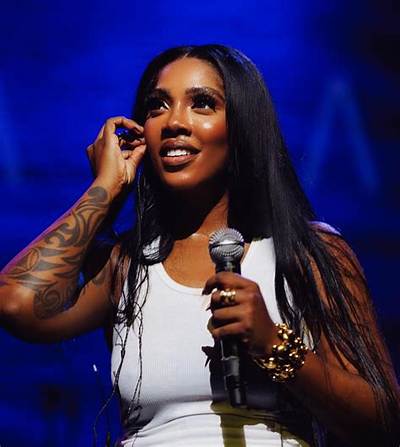 Tiwa Savage Slays in Show-Stopping White Dress, Poses with Son, Fans React: "She's Finer Than This"