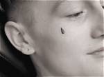 What Does an Unfilled Teardrop Tattoo Mean?